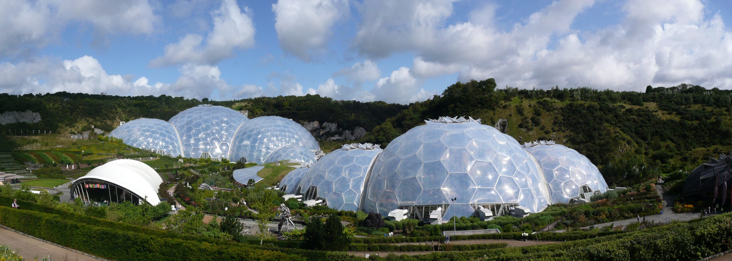 numerous geodomes at the eden project against a background of a cloudy sky